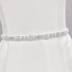 a white dress with a belt on it