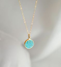 Add some bright color to your look this necklace! Featuring a polished Turquoise slice on your choice of a sterling silver or 14k gold filled chain, this gemstone is believed to bring balance and serenity to its wearer. Turquoise is also the birthstone for December!Stone Size: average 12mm (.47") Modeled Size: 16 Inches Turquoise Jewelry With Delicate Chain For Gift, Turquoise Pendant Jewelry With Delicate Chain, Turquoise Pendant With Delicate Chain, Turquoise Sterling Silver Necklace With Delicate Chain, Minimalist Turquoise Nickel-free Necklace, Dainty Yellow Gold Turquoise Necklace For Gift, Dainty Turquoise Pendant Necklace, Turquoise Sterling Silver Jewelry With Delicate Chain, Turquoise Necklace With Natural Stones For Everyday