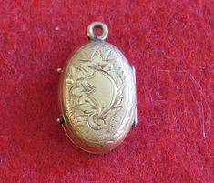 "An Awesome 1890's Victorian 14 Karat Yellow Gold Locket With Photos Necklace Pendant. Visit our shop for awesome retro photos, vintage jewelry, sports memorabilia and home decor. Size: 1/2\" across x 3/4\" high Material: 14 Karat Yellow Gold Condition: Good. Front Is Bowed In. Photos Show Wear. Year: 1890's Signed: Unsigned. Inventory #: 2280" Vintage Antique Gold Filigree Jewelry, Vintage Antique Gold Locket Necklace For Wedding, Vintage Jewelry With Intricate Design For Collectors, Vintage Jewelry In Antique Gold, Vintage Collectible Jewelry With Intricate Design, Vintage Antique Gold Collectible Jewelry, Vintage Antique Gold Jewelry Collectible, Vintage Antique Gold Jewelry For Collectors, Vintage Jewelry Pendant With Antique Finish