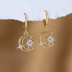 "Moon and Star Pave Huggie Earrings, Gold Diamond Dangle Earrings, Celestial Jewelry. Perfect Gift for Her, 21st birthday gift for her ✨These earrings feature a charm of your choice hanging from a dainty 18k Gold Plated huggie hoop. These hoops are sold as SINGLES, or by PAIRS - both options are available to select from the 2nd drop down menu. Mix & match these earrings to create fun and unique pairs! * Bezeled Moonstone Hoop Available to Purchase HERE: https://www.etsy.com/listing/1253212496/ * Celestial Round Crystal Earrings As Gift, Celestial Round Crystal Earrings For Gift, Celestial Star-shaped Crystal Earrings For Gift, Celestial Star-shaped Crystal Earrings Gift, Celestial Star-shaped Crystal Earrings, Hypoallergenic Celestial Round Earrings, Celestial Star Charm Round Earrings, Celestial Style Drop Earrings, Celestial Earrings With Star Charm As Gift