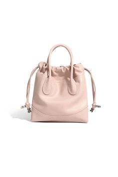 Perfectly Crafted Leather Mini Tote for Every Occasion Introducing our 2024 Leather Mini Tote Bag, crafted from premium calfskin in a soft pink hue. This stylish bag features sturdy top handles and an adjustable shoulder strap, offering versatile carrying options. The unique drawstring design enhances security while adding a playful touch. Perfect for daily commutes and casual outings. Style #: WWAJ804 Bags 2024, Leather Suitcase, Casual Activewear, Female Shoulder, Luxury Girl, Mini Tote Bag, Shoulder Messenger Bag, Mini Tote, Stylish Bag