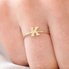 Gold Kt: 14K Solid Gold
Width of Band: 1.2MM
Size of Letter: 5mm

Show off your personalized style in our gold initial ring. The ring features a solid gold design available in any letter of your choice. Dainty and chic, this gold letter ring can be worn to represent the one you love or as a fashion piece that's all about you. K Ring, Indian Room, Gold Initial Ring, Measure Ring Size, Baby Rings, Rings Collection, Letter Ring, Gold Letter, Local Jewelry