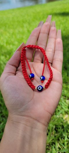 "The Universe serves as your guardian; may you walk your path in protection and peace." Our delicate Handmade Evil Eye Bracelet is beautifully handcrafted to ward off malevolent glares, misfortune, or bad luck. The Evil Eye symbol in the center creates a protective shield around you and deflects all negative energies that can affect your good fortune. Handmade bracelet Adjustable to fit both Men and Women Glass Evil Eye Beads Symbolic Handmade Bracelets For Friendship, Symbolic Handmade Friendship Bracelets, Adjustable Spiritual Braided Bracelet With Evil Eye, Adjustable Braided Evil Eye Bracelet For Spiritual Protection, Adjustable Spiritual Evil Eye Braided Bracelet, Handmade Spiritual Wristband For Festivals, Handmade Spiritual Bracelet For Friendship, Spiritual Handmade Wristband For Festivals, Handmade Spiritual Braided Bracelets