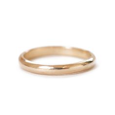 If someone were to ask you to picture a "classic wedding band" in your head, this would be the band to win every time. 14K yellow gold is the most classic choice for wedding bands, and one of our best sellers! Handmade in our Vermont studio using recycled gold, you can be sure this symbol of your love is made with love. Band and Width: A half-round 2mm, or 5mm wide band. For a more delicate look, choose the dainty 2mm band or go for a bolder option with the 5mm.Metal: Pictured in 14K yellow gold Elegant Wedding Bands With Smooth Bezel, Elegant Wedding Band With Smooth Finish, Timeless Stackable Rings With Smooth Bezel For Wedding, Timeless Wedding Stackable Rings With Smooth Bezel, Timeless 14k Gold Stackable Wedding Rings, Timeless 14k Gold Bands With Round Cut, Timeless Stackable 14k Gold Wedding Rings, Minimalist Wedding Bands With Smooth Finish, Classic Stackable Wedding Rings With Round Band