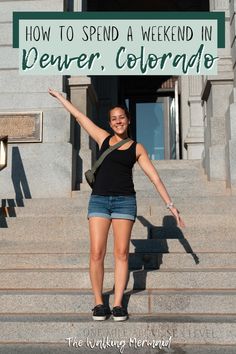 a woman is standing on the steps with her arms in the air and she's smiling