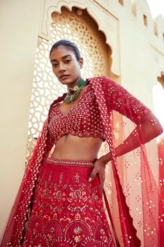 Red raw silk floral embroidered lehenga with thread work and sequence detailing paired with scallop edge v neck elbow sleeve heavily embroidered blouse and matching tulle dupatta with embroidered border and all over badla .From Chamee and Palak's The Romantics collection.DELIVERY TIMEPlease allow 8-12 weeks for your outfit to arrive.FABRIC DETAILSRaw Silk and Net Professional cleaning only. Festive V-neck Lehenga With Dupatta, Festive V-neck Lehenga For Reception, Anarkali Saree With V-neck And Resham Embroidery, Anarkali Saree With Resham Embroidery, Semi-stitched V-neck Set For Reception, Designer V-neck Lehenga For Festivals, V-neck Lehenga With Resham Embroidery For Diwali, Bollywood Style V-neck Sets For Reception, Diwali Lehenga With Resham Embroidery And V-neck