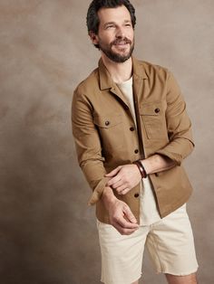 An splendid example of rugged luxury, this magnificent shirt jacket is based on a piece from the archives, crafted here in a soft cotton twill, a delightful contrast to its masculine silhouette.  Point collar.  Chest pockets.  Button front.  Straight Beige Cotton Shacket With Buttons, Classic Long Sleeve Utility Jacket For Everyday, Khaki Cotton Shacket With Buttons, Cotton Shacket With Button Cuffs, Cotton Long Sleeve Shacket With Button Cuffs, Khaki Button-up Utility Jacket With Welt Pockets, Unstructured Cotton Button-up Utility Jacket, Long Sleeve Cotton Shacket With Buttons, Cotton Long Sleeve Shacket With Buttons