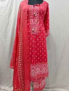 Product Details Pink printed Anarkali style Kurta with Trouser & dupatta Kurta design: Ethnic motifs  * Anarkali shape * Pleated style * Round neck, three-quarter regular sleeves * Sequined detail * Calf length with flared hem * Viscose Rayon fabric Trouser design: *Printed Trouser  *Elasticated waistband * Slip-on closure Material & Care Kurta: Viscose Rayon  Trouser: Viscose Rayon  Dupatta: Cotton Blend  Machine Wash Items Includes: One Piece Kurta One piece Dupatta One Piece Trouser  Note:- Please see the size chart in the image to choose a perfect size. Please feel free to ask any questions regarding this item WE ALSO ACCEPT CUSTOMISATION AS PER CUSTOMER REQUESTS. Bollywood Style Churidar With Chikankari Embroidery For Festivals, Bollywood Bandhani Print Palazzo Set, Designer Georgette Palazzo Set With Bandhani Print, Pink Chanderi Sharara With Printed Motifs, Red Traditional Wear With Printed Motifs For Transitional Season, Unstitched Anarkali Churidar For Navratri, Red Sharara With Bandhani Print And Straight Kurta, Designer Bandhani Print Anarkali Set In Georgette, Designer Georgette Anarkali Set With Bandhani Print