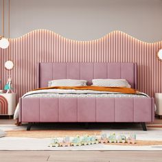 a bedroom with pink bedding and decorative wallpaper on the walls, along with two nightstands