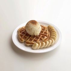 a plate with waffles and ice cream on it