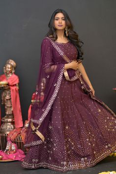 Plum Purple mirror work lehenga choli Matched with Purple mirror work blouse with quarter sleeves. Designed with round neck and has back hooks. Set together with a matching soft net purple duppata with mirror work and have gold border The length of the blouse is 14 inches. Blouse can fit a size 32 to 42 The maximum length of the lehenga will be 41 inches. Slight variation in color is possible due to digital photography. This is a 3 piece set. Care: dry clean only We provide side fitting/sleeves Anarkali Choli With Mirror Work For Eid, Floor-length Mirror Work Sharara For Navratri, Floor-length Kundan Anarkali Set With Mirror Work, Purple Chanderi Sharara For Navratri, Anarkali Chanderi Choli With Mirror Work, Floor-length Sharara With Mirror Work For Navratri, Diwali Floor-length Sharara With Mirror Work, Purple Gota Work Sets For Eid, Purple Sets With Gota Work For Eid