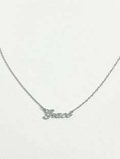 Our best selling personalised name necklace in silver is what we dream about. This necklace is the perfect every day name necklace. This silver name necklace is crafted from high quality stainless steel for a water and tarnish resistant finish. You can wear this custom piece every day. Sterling Silver White Name Necklace, Classic Silver Tarnish-resistant Name Necklace, Silver Tarnish-resistant Name Necklace For Gift, Adjustable Silver Nickel-free Name Necklace, Nickel-free Sterling Silver Name Necklace, Day Name, Silver Name Necklace, Name Necklace, Initial Necklace