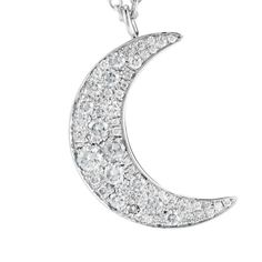 White gold moon pendant set with pave diamonds. . 18k white gold . 0.4 cts of pave diamonds . chain measures 26" Luxury Silver Necklace With Moon Charm, White Gold Diamond Necklace With Moon Charm, Silver Crescent Diamond Necklace, Silver Crescent Necklace With Diamond Accents, Silver Moon Necklace With Diamond Accents, Celestial White Gold Diamond Necklace, Silver Half Moon Diamond Jewelry, Gold Moon, Moon Pendant