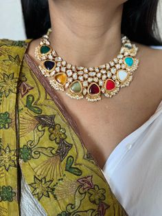 Be your own kind of beautiful. Simply a mark of royalty and elegance! You will definitely fall in love with the beautifully placed multicolored stones with Kundan Stone embellishments. One of our favorite picks for the wedding season ❤️ The pretty statement earrings add to the royalty of the stunning choker necklace. Length of earrings: 7 cms  Width of earrings: 3.3 cms Luxury Elegant Kundan Necklace With Cutdana, Luxury Blue Traditional Kundan Necklace, Fusion Style Multicolor Kundan Necklace For Party, Elegant Multicolor Kundan Necklace For Celebrations, Multicolor Jewelry With Intricate Design For Party, Formal Multicolor Kundan Necklaces, Fusion Style Multicolor Bridal Necklace With Intricate Design, Party Multicolor Fusion Kundan Necklace, Fusion Style Multicolor Bridal Necklace For Festivals