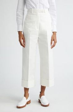 Crisply pressed pleats bring angularity to the straight-cut legs, and wide fold-over cuffs hit just above the ankles in these seasonally spot-on cotton pants. 25" inseam; 22" leg opening; 14" front rise; 20" back rise (size 42IT) Zip fly with hook-and-bar closure Side-seam pockets 100% cotton Dry clean Made in Italy Designer Clothing Crop Pants, Cotton Pants, Thom Browne, Straight Cut, Cropped Pants, Bottoms Pants, Cotton Canvas, Womens Bottoms, Designer Clothing