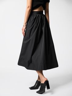 Classic mid-calf length flared and pleated skirt. Voluminous style. Oversized A line skirt. Model is in MINUSEY S. ✔️ Free worldwide express shipping over $100✔️ Loved by 6,500+ customers✔️ Limited edition collections, maximum style⠀⠀⠀⠀⠀⠀⠀⠀⠀Stay ahead of the trend with can’t-find-anywhere-else staples. Your closet will thank you 💕 * MINUSEY S = EU 34, US 2* MINUSEY M = EU 36, US 4* 100% Polyester* Dry clean* Made in Korea - Model Height: 172cm/5'7" (US2, EU34) Black A-line Voluminous Skirt, Black Midi Length Gathered Skirt, Black A-line Pleated Maxi Skirt, Black A-line Pleated Skirt, Black Midi Length Accordion Pleated Skirt, Black Flared Skirt With Pleated Hem, Flowy Gathered Skirt With Wide Hem, Black Pleated Wide Leg Culottes, Black A-line Maxi Skirt With Gathered Details