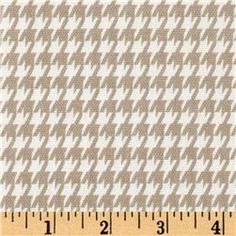 a ruler is next to a brown and white checkered fabric