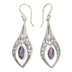 Inspired by the jewelry work of his mother, Wirabhuwana crafts these elegant dangle earrings by hand. Sterling silver with openwork Balinese motifs, and featuring two carats of glittering purple amethyst, these earrings are truly a wonder to behold. Sterling silver, amethyst Hook earrings Combination finish Handmade in & fairly traded from Indonesia Due to the natural materials used in this item, color may vary slightly Paw Print Jewelry, Ribbon Jewelry, Jewelry Workshop, Printed Jewelry, Silver Dangle Earrings, Amethyst Earrings, Balinese, Silver Earrings Dangle, Handmade Sterling Silver