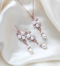 This rose gold bridal necklace and earrings set brings together the best of the best: rose gold, a metal that is highly appreciated these days for its romantic feeling; crystals, an element that adds shine and glamour to your entire look; and pearls, which add that perfect touch of timeless elegance. Such a stunning bridal jewelry set! Earrings dangle 2-3/8 inch and are 3/4 inch at their widest. Necklace measures 16 inches and extends to 18 inches. PLEASE ALLOW APPROX 7 BUSINESS DAYS FOR COMPLETION BEFORE SHIPPING.Gorgeous sparkle !This is an original design by © Treasures by Agnes FOR MATCHING PIECES SIMPLY TYPE "MIA" IN THE SEARCH BAR Best Rose, Gold Bridal Necklace, Pearl Drop Necklace, Rose Gold Bridal, Set Earrings, Search Bar, Necklace And Earrings Set, Necklace And Earring Set, Gold Crystal