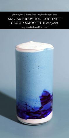 a blue and white container with some black writing on it's side, in front of a gray background