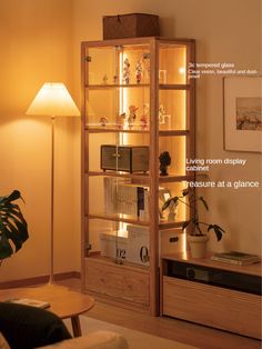 a living room filled with furniture next to a wall mounted shelf and a lamp on top of it