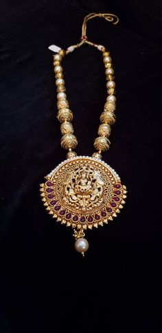 "Handmade Indian Temple Jewelry, best to wear it for traditional ceremonies or Indian wedding. This bridal jewelry has ethnic finish. It has Cubic Zircon stones with ruby and emeralds. It is a Bollywood style one gram jewelry. There are long and short patterns of Indian jewelry in Kundan, Pearls, CZ, American Diamond , ruby, emerald, Polki, kemp to suit every occasion of South Indian and North Indian weddings. Handmade Indian Jewelry item * Stunning Hand made Traditional jewelry set. * Necklace 22k Gold Temple Jewelry For Puja, Yellow Gold Kundan Necklace For Diwali Puja, 22k Gold Kundan Necklace With Intricate Design For Puja, Gold Kundan Temple Jewelry Necklace, Temple Jewelry In 22k Gold With Zari Work, 22k Gold Temple Jewelry With Zari Work, 22k Gold Meenakari Temple Necklace For Rituals, Yellow Gold Temple Jewelry With Zari Work, 22k Gold Jewelry For Rituals And Festivals