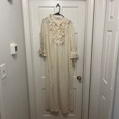 -Has Original Tag -Slightly Discolored For Age -Ruffled Trim In The Front With 4 Buttons Feminine Long Sleeve Sleepwear With Ruffles, Feminine Long Sleeve Ruffled Sleepwear, White Ruffled Dress For Home, Feminine Ruffled Nightgown For Sleep, Elegant Ruffled Nightgown For Spring, Elegant Ruffled Nightgown For Wedding Night, Vintage Nightgown With Ruffles For Loungewear, Vintage Ruffled Nightgown For Loungewear, Spring Nightgown With Ruffles For Bedtime