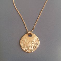 This 18K gold plated MOON necklace is perfect for your day to day life. You can customize by layering other dainty necklaces with it, or let it shine on its own. You can wear this full moon disc necklace all year round with your favorite sweater or sundress. Gold circle necklace is perfect for you, Cheap Metal Necklace With Oval Pendant, Luxury Everyday Hammered Necklaces, Chanel Necklaces, Moon Necklace Gold, Full Moon Necklace, Gold Medallion Necklace, Gold Moon Necklace, Gold Circle Necklace, Dainty Diamond Necklace