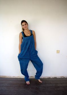 "Vintage Yessica at C & A blue denim overalls, high waist with a cord for cinching, oversized fit, green plastic buckle, adjustable straps, two large side pockets, adorn red, blue, and green stitches on the left pocket. aside from minor signs of wear, good vintage condition clean, and ready to wear. **Model is 5'7\" and size S for reference.**   Approximate size: One size fits most - Tag size: 44 - Please refer to the measurements M E A S U R E M E N T S -were taken with garments laying flat, pl 90s Style Blue Denim Overalls, Casual Blue Full-length Overalls, Casual Full Length Blue Overalls, 90s Style Blue Cotton Denim Jumpsuit, 90s Blue Cotton Denim Jumpsuit, 90s Blue Denim Jumpsuit With Pockets, Blue Full-length Denim Jumpsuit For Summer, Full-length Blue Cotton Denim Jumpsuit, Relaxed Fit High Waist Medium Wash Overalls