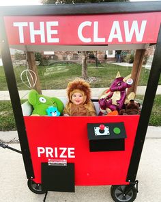 there is a claw game with stuffed animals in the front and on the back for kids to play