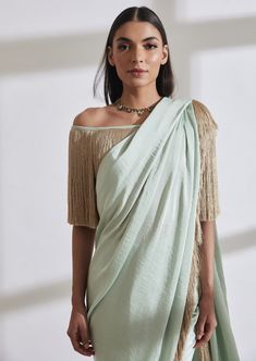 Our noor fringe sari features a full pre-draped sari that looks like a regular sari with our signature fringe detail. Pair it with the off shoulder fringe top or get in touch for more blouse options. Drape Sarees, Neeta Lulla, Manish Malhotra, Tarun Tahiliani, Green Aqua, Fringe Top, Satin Color, Designer Gowns, Aqua Green