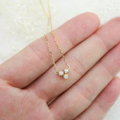 14k solid gold diamond trio necklace three diamond floating | Etsy Minimalist Yellow Gold Three Stone Jewelry, Dainty Three Stone Cubic Zirconia Jewelry, Minimalist Three Stone Jewelry, Minimalist Three-stone Diamond Jewelry, Minimalist Three Stone Diamond Jewelry, Delicate Three-stone Diamond Jewelry, Delicate 14k Gold Three-stone Jewelry, Delicate Three Stone 14k Gold Jewelry, Dainty 14k Gold Three-stone Jewelry