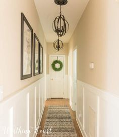 the hallway is clean and ready to be used as a place for pictures on the wall