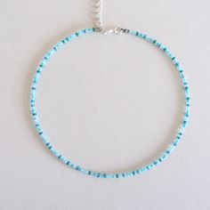 Turquoise Bead Choker White Beaded Choker Seed Bead Choker Colorful Bead Choker Boho Choker Trendy Choker Beach Choker Seed Bead Necklace Measure the length of your neck with a measuring tape or you can use any thread, rope, or cable for telephone and after apply the measurements to a regular ruler. These are multi-colored, opaque shiny beads of size 10/0. Choker is 13 inches with a 2 inches adjustable extender chain. 15 inches full length. Bohemian Beaded Necklaces With Spacer Beads For Vacation, Bohemian Beaded Necklace For Vacation, Summer Beach Beaded Necklaces With Spacer Beads, Summer Beach Beaded Necklace With Spacer Beads, Handmade Blue Turquoise Necklace For Summer, Beach Turquoise Heishi Beads Necklace, Handmade Turquoise Necklace For Summer Beach, Tiny Beads Strand For Festival, Heishi Beads Beaded Necklace For Summer