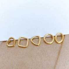 We are a customised jewellery store and we do not normally hold stock. We aim to dispatch your jewellery within 2-3 weeks of ordering. Please DO NOT order if you need this piece urgently.  Material: 18K solid gold, G18K/AU750 hallmarked. Sizes: all sizes below are hand measured, please expect slight variances.  Oval: 7.5mm*9mm, thickness 1.4mm  Square: 9mm*9mm,thickness 1.4mm Heart: 8.2mm*9.2mm, thickness 1.4mm  Circle: 9.1mm, thickness 1.4mm Triangle: 9mm, thickness 1.4mm These enhancer connect Gold Stackable Earrings For Gift, Gold Stackable Hoop Earrings As Gift, Stackable White Gold Huggie Earrings, White Gold Stackable Huggie Jewelry, Stackable Yellow Gold Earrings For Gift, Fine Gold Huggie Jewelry, Minimalist Gold Huggie Jewelry, Everyday Gold Huggie Rings, Recycled Gold Jewelry With Spring Ring Clasp