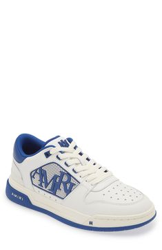 AMIRI adds a new sneaker to their lineup with this low-top style that features a rubberized logo detailing the mesh sidewall and tiny star-shaped perforations. Lace-up style Removable insole Leather upper/textile lining/rubber sole Imported Designer Shoes Blue Lace-up Sneakers With Logo, Blue Sporty High-top Sneakers With Logo, Blue Sporty Sneakers With Logo, Low-top Sneakers For Light Sports With Logo, Blue Logo Sneakers For Streetwear, Sporty Low-top Basketball Shoes With Embossed Logo, Blue Leather Sneakers With Logo, Blue Sneakers With Embossed Logo For Streetwear, Low-top Logo Sneakers In Athleisure Style