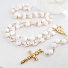 This Personalized Rosary, is ideal as a Baptism gift for a little girl or baby boy or as a gift for a special occasion. It is expertly handcrafted in a traditional style with a contemporary twist utilizing genuine Mother of pearl stone and gold-plated brass wire, which not only gives a touch of nature but also tenderness. The letter beads on the Rosary are also handmade from genuine mother of pearl, and the length is perfect to worn as a dainty Rosary necklace for women. *MATCHING ROSARY BRACELE Customizable Gold Jewelry For First Communion, Customizable White Necklaces For Personalized Gift, Customizable White Jewelry Gift, White 8mm Beads Jewelry As Gift, White Jewelry With 8mm Beads As Gift, Pearl White Jewelry With 8mm Beads As Gift, Handmade White Jewelry For Personalized Gift, White Jewelry With 8mm Beads For Gift, Spiritual Beaded Jewelry For Personalized Gift