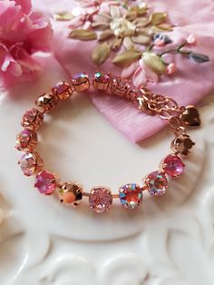 Always beautiful and elegant Swarovski Crystal Bracelets, perfectly stunning for all occasions. This Delightful Pink Sunset Crystal bracelet has been lovingly handmade and makes a special gift for that someone special in your life, or simply treat yourself to something lovely and indulgent. This pretty Crystal bracelet features the gorgeous combination of Beautiful Pink tones, complimented with Rose Gold Crystals for that extra bling and has been set in a Rose Gold (Nickel Free) plated setting, Sunset Crystal, Gold Crystals, Bracelet Rose Gold, Rose Gold Crystal, Swarovski Crystal Bracelet, Rose Gold Heart, Pink Sunset, Wedding Jewelry Bracelets, Pink Tone