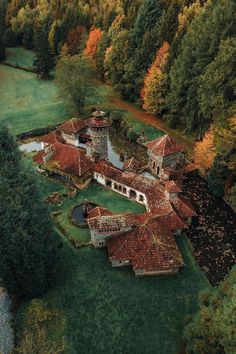 an aerial view of a house surrounded by trees