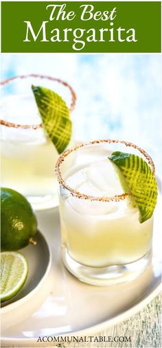 two margaritas with lime slices on the rim