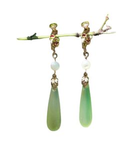 Indulge in luxury with our Chic Green Sterling Silver Alloy Pearl Drop Earrings. The alluring green stones sit delicately on the sterling silver alloy, reflecting sophistication and elegance. The perfect accessory for any occasion, these earrings will elevate your style and leave a lasting impression. Measurement: 5cm/1.95" * 0.9cm/0.351". Matches easily with daily hairstyle. dresses & Shirts Green Fine Jewelry Drop Earrings, Fine Jewelry Green Drop Earrings, Green Jade Earrings For Pierced Ears, Elegant Green Crystal Earrings For Pierced Ears, Jade Dangle Earrings For Pierced Ears, Green Crystal Earrings For Pierced Ears, Teardrop Jade Earrings For Formal Occasions, Elegant Green Teardrop Earring (single), Elegant Green Crystal Dangle Earrings