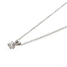 There's something classic and luxurious about a high quality single diamond hanging around your neck. This diamond solitaire pendant necklace is made from solid platinum and measures 18" long. The diamond is GIA certified as an all-natural .92ct G/VS2 round brilliant cut diamond securely set in a four prong basket style setting. This necklace comes with the GIA certificate and a free official appraisal showing the value of the necklace at $9650. Formal Brilliant Cut Solitaire Necklace With Round Pendant, Formal Solitaire Necklace With Brilliant Cut Round Pendant, Formal Solitaire Pendant Necklace With Brilliant Cut, Formal Diamond White Solitaire Pendant Necklace, Formal Brilliant Cut Round Pendant Solitaire Necklace, Formal Diamond White Solitaire Necklace, Formal Solitaire Pendant Necklace With Diamond Cut, Timeless Platinum Solitaire Necklace With Round Pendant, Timeless Solitaire Pendant Necklace In Brilliant Cut