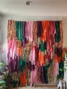 there are many different colored ribbons hanging on the wall