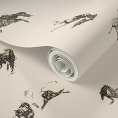 a white wallpaper with black horses on it's sides and the background is very rough