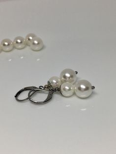 "Double pearl silver dangle earrings 10mm Japanese glass white pearl and 8mm shell pearl stainless steel alloy silver plated rhinestone disc, 1.25\" dangle earrings. Available in lever backs and fish hook. Hand made jewelry! All purchase will arrive in gifts boxes Thanks for stopping by!" Adjustable Pearl White Dangle Earrings, White Tarnish-resistant Dangle Pearl Earrings, White Pearl Charm Earrings In Metal, White Metal Pearl Earrings, Pierced, White Shell-shaped Pearl Drop Earrings, Round Pearl Earrings, Gifts Boxes, White Pearl Earrings, Earrings Classic