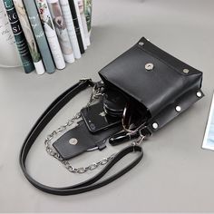 Specification:Material: PU leatherSize: 20*16*12 cm Usage: Shoulder Bag, Handbags,Crossbody bag [23y 9m 19d] Black Punk Rectangular Shoulder Bag, Trendy Large Capacity Black Phone Bag, Edgy Large Capacity Rectangular Shoulder Bag, Black Rectangular Punk Bag, Black Rectangular Punk Style Bag, Punk Style Black Rectangular Bag, Edgy Large Capacity Leather Shoulder Bag, Edgy Leather Shoulder Bag With Large Capacity, Black Faux Leather Phone Shoulder Bag