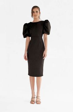 Alice is the perfect dress for a day in office followed by a dinner with friends. The puffed sleeves and V backline details make it stand out while its silhouette allows for an elegant and sophisticated look. Office compatible on its own but easy to dress it up with jewellery for after work.95% PE 5% SPModel is 5'9" tall and wears a size XS. Midi length Zip on the back Puffed sleeves Chic Puff Sleeve Dress With Draped Sleeves For Party, Evening Puff Sleeve Dress With Structured Shoulders, Evening Puff Sleeve Dress With Elastic Sleeves, Elegant Midi Dress With Lantern Sleeves For Night Out, Chic Evening Puff Sleeve Dress With Draped Sleeves, Elegant Party Midi Dress With Elastic Sleeves, Elegant Lantern Sleeve Midi Dress For Night Out, Fitted Midi Dress With Elastic Sleeves For Cocktail, Formal Midi Dress With Structured Puff Sleeves