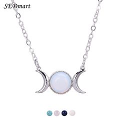 the moon and crescent necklace with white opal stones on a silver plated chain