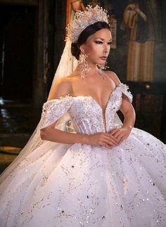 a woman in a wedding dress with a tiara