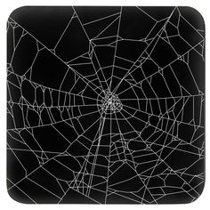 a black and white photo of a spider web on a square plate, with lines running through it